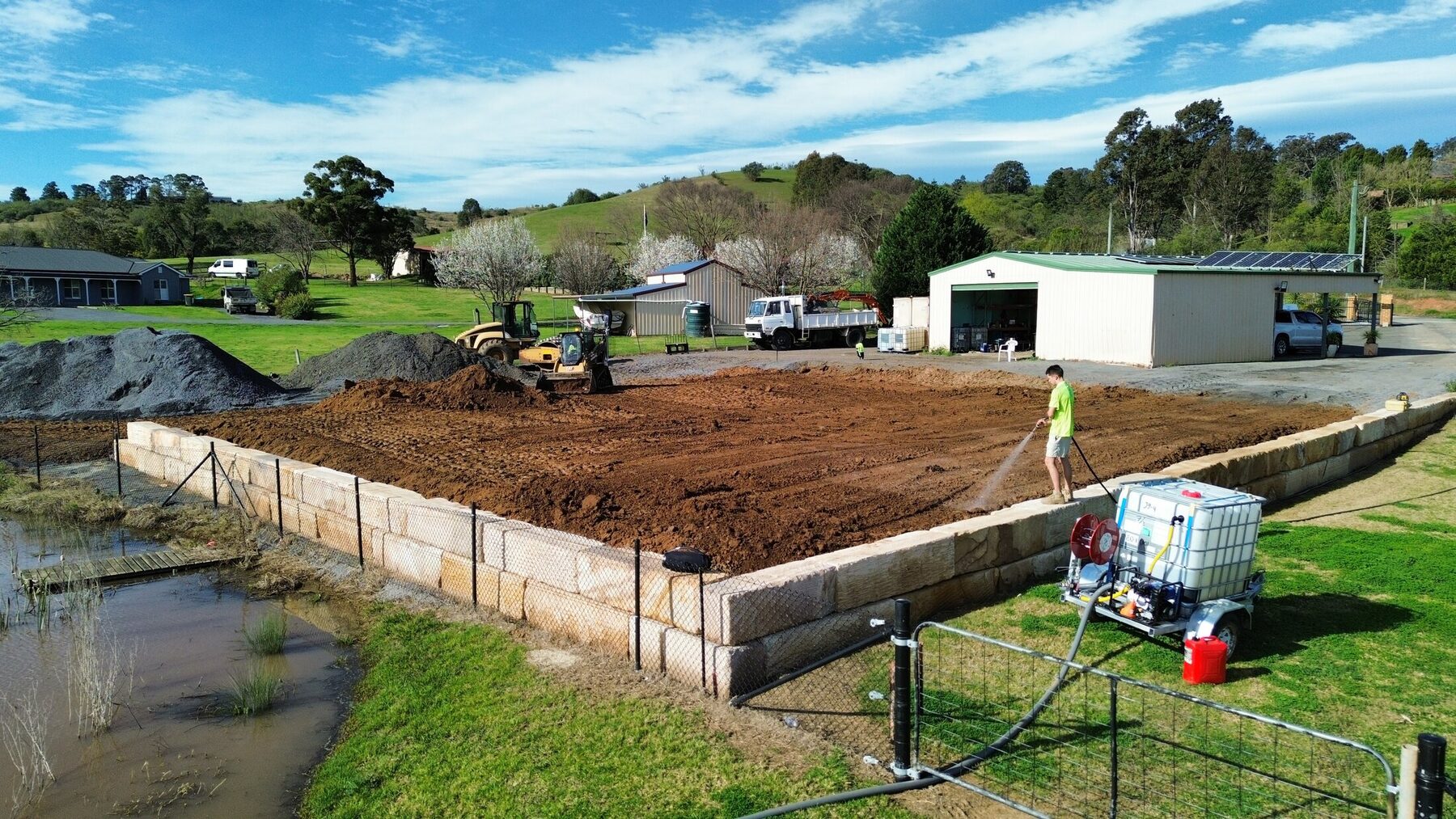 Completed rural sandstone-retained platform viewed from the air