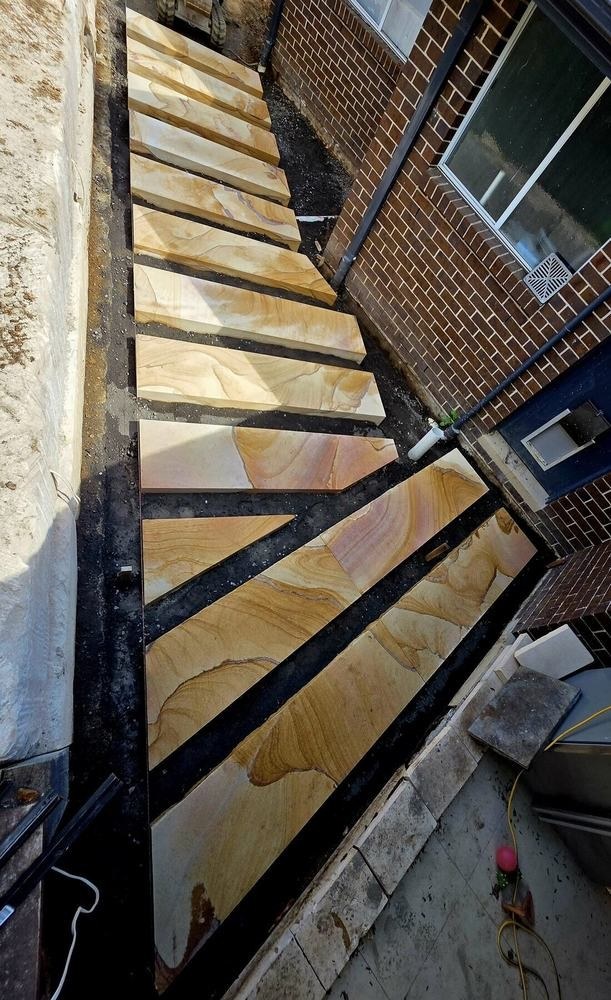 Camden Acres backyard pathway built with natural sandstone steppers