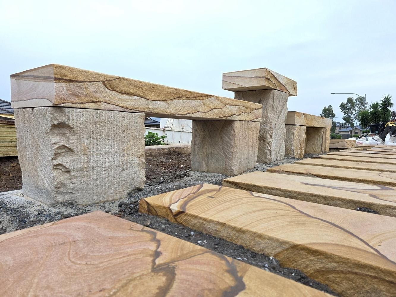 Table and chairs made from log offcuts and diamond-sawn slabs